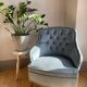Fauteuil chauffeuse capitonnée