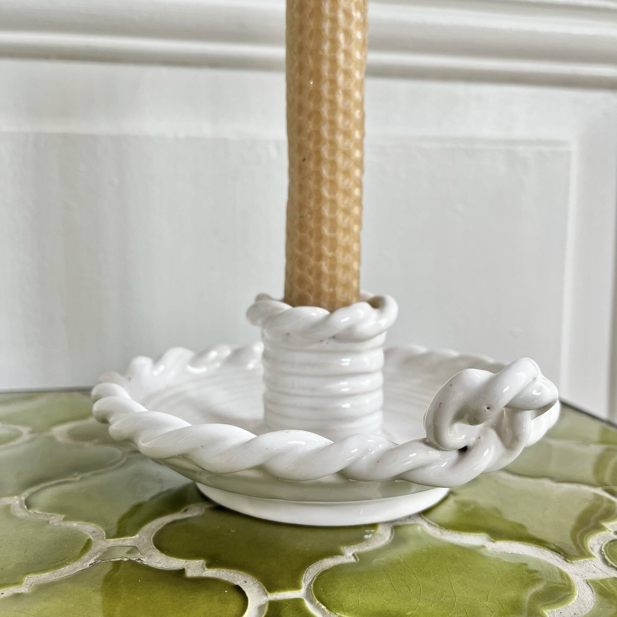 Hand-held candle holder with braided ceramic bowl
