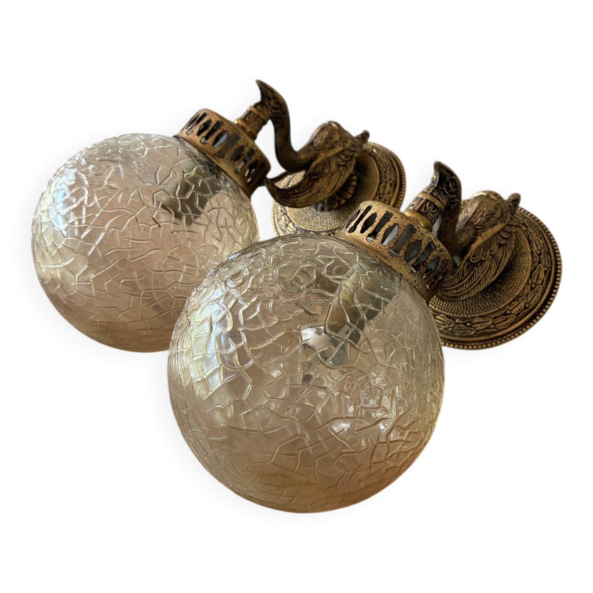 Pair of vintage wall sconces with golden metal swan heads and glass.