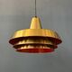 Mid-century Danish style orange brass suspension light.