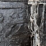 huge old fireplace plate has decoration of angels, crown and fleurs-de-lis