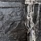 huge old fireplace plate has decoration of angels, crown and fleurs-de-lis