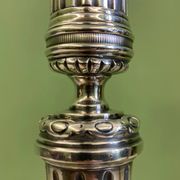 Pair of silvered bronze candlesticks in the Louis XVI style signed Voisenet, 19th century.