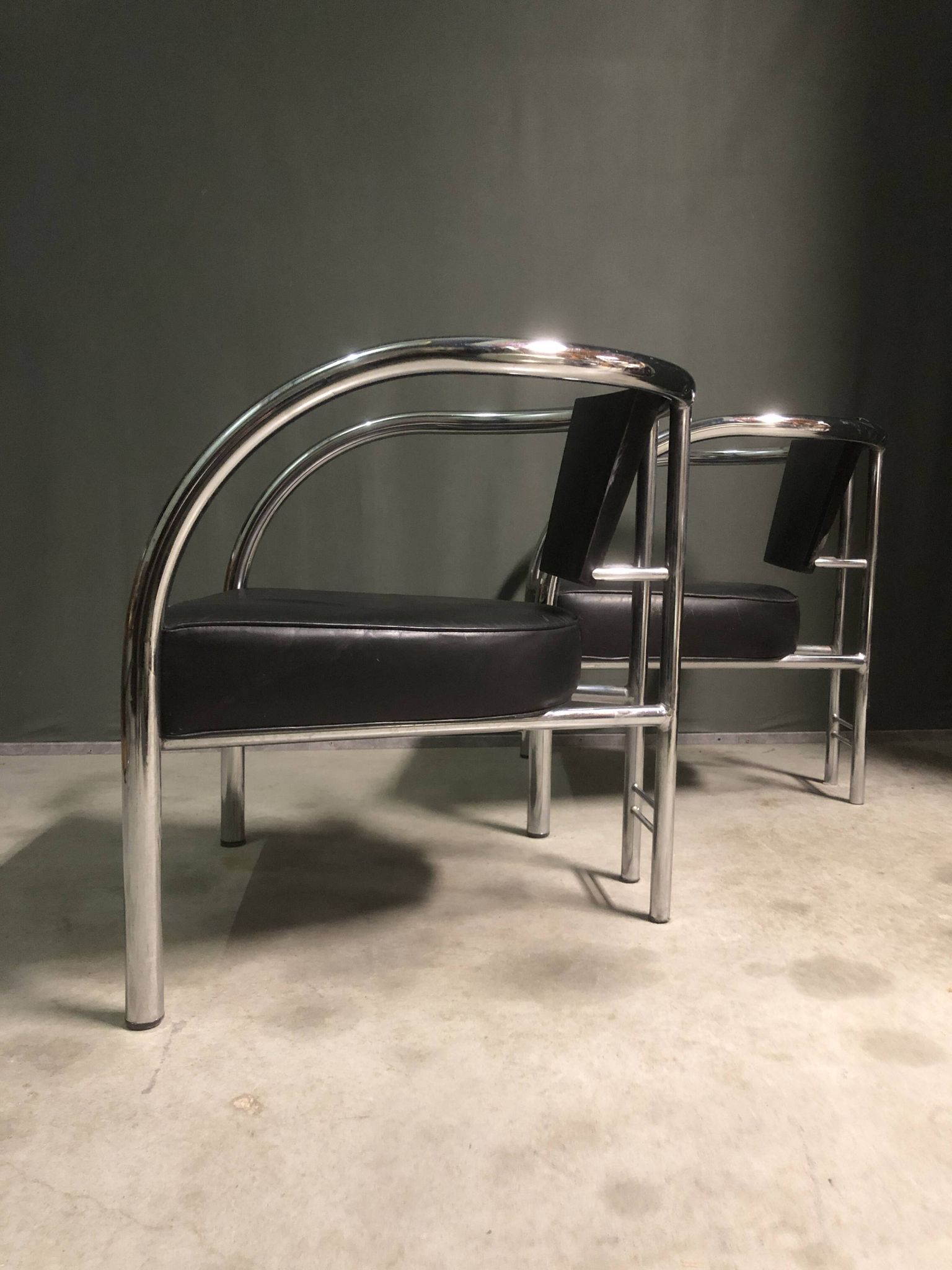 A pair of petite low armchairs by ronald cecil sportes for lumen center, 1987