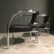 A pair of petite low armchairs by ronald cecil sportes for lumen center, 1987