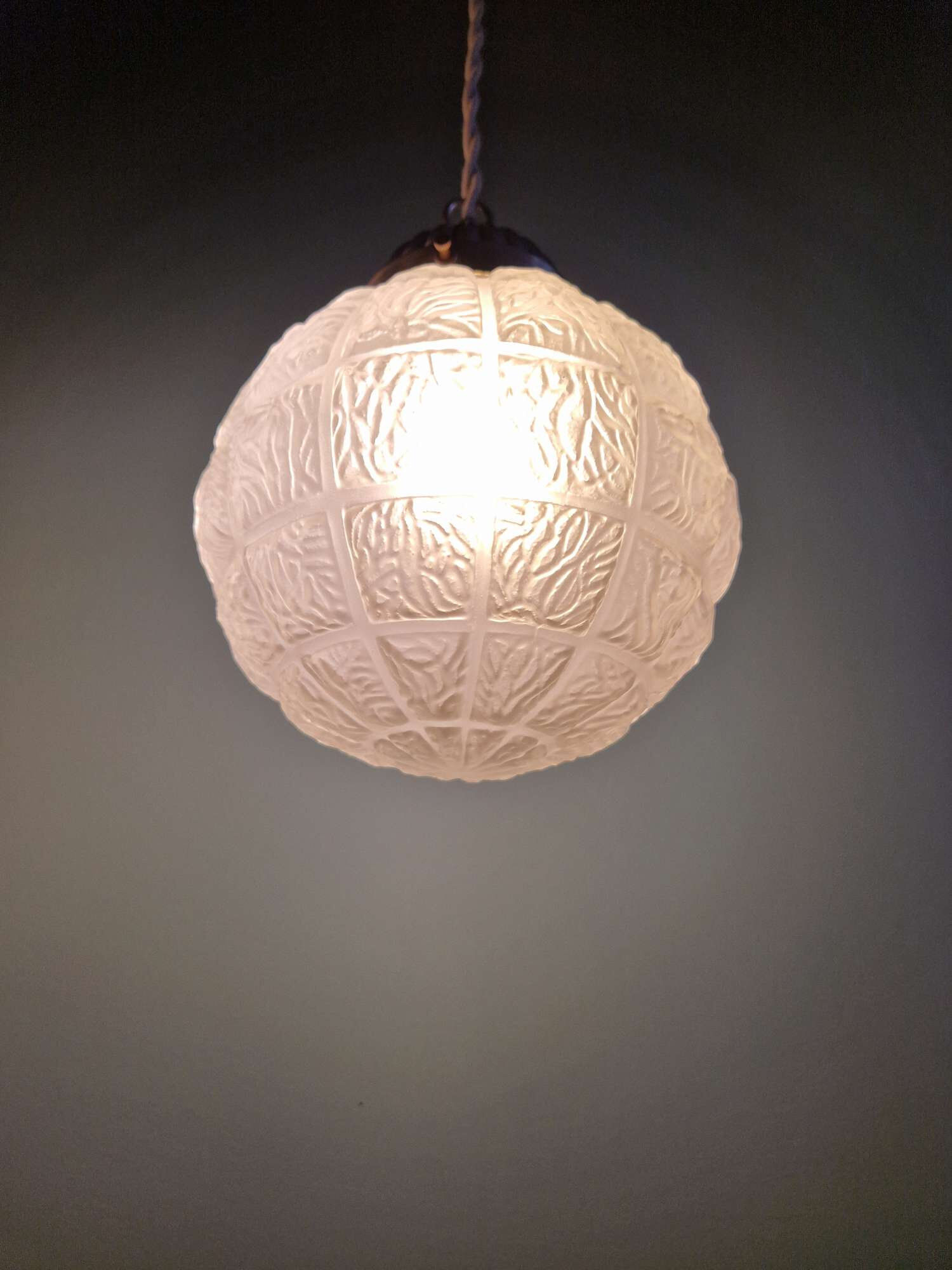 Art Deco trio of frosted glass pendants, 1920s-30s.