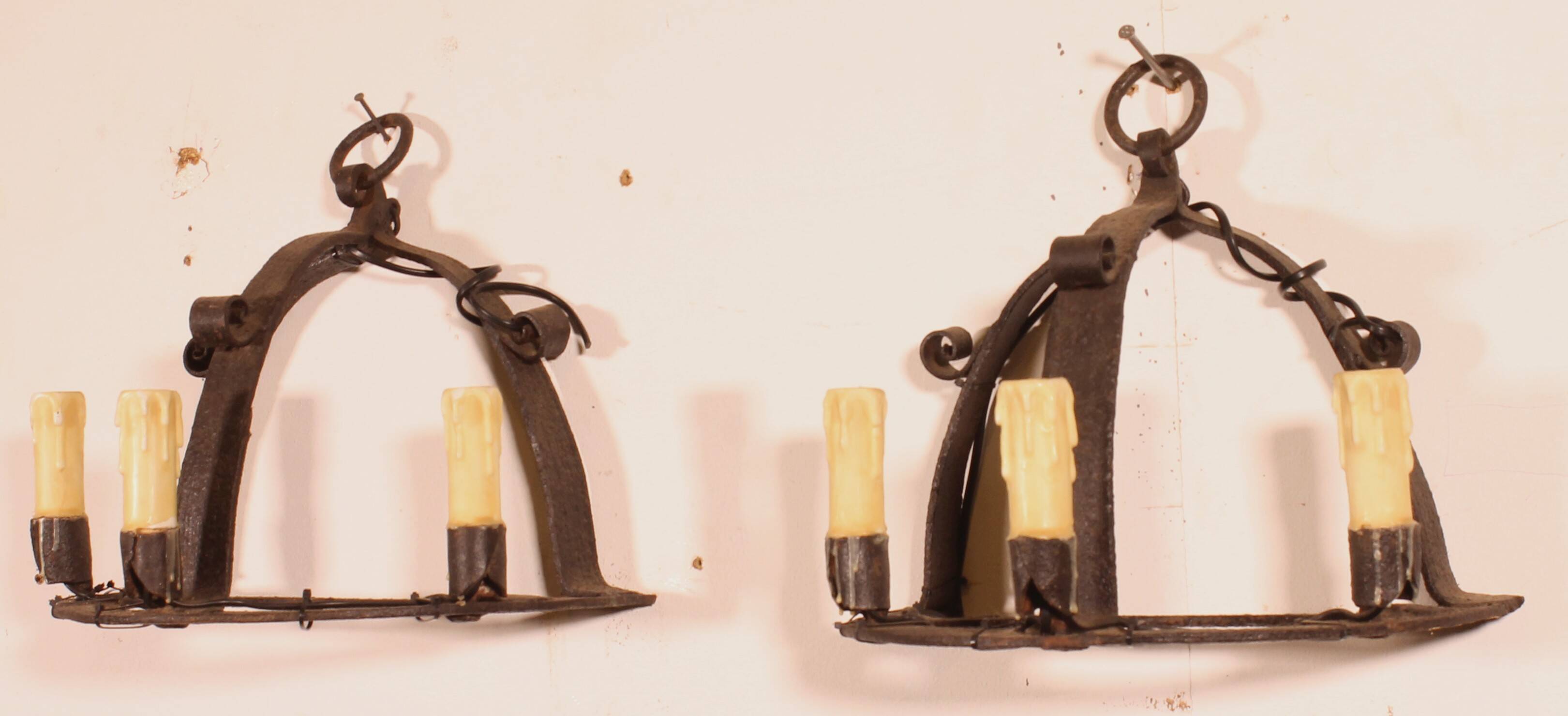 Pair of wrought iron wall sconces in medieval style
