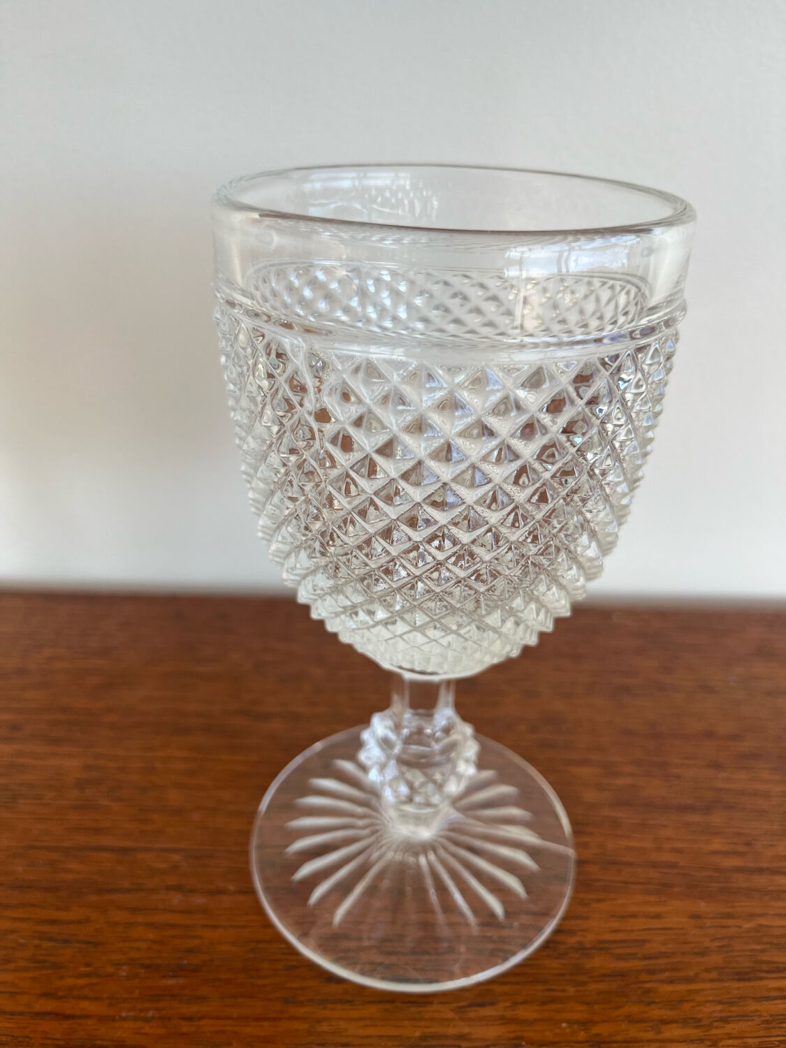 Two 19th-century moulded crystal glasses with diamond points.