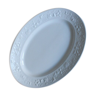 Old white serving dish in white earthenware