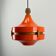 1970s orange Scandinavian suspension light in plexiglass shaped like a UFO.