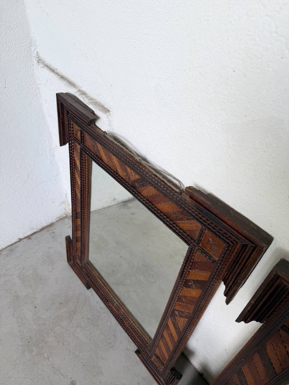 Pair of wooden mirrors in tramp art style