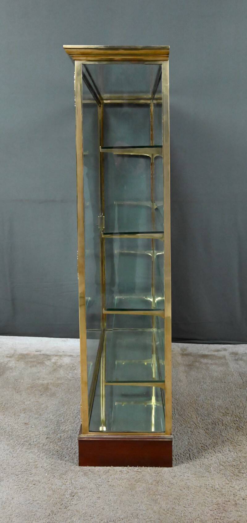 Brass display cabinet with a mirrored back – early 20th century