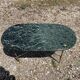Table basse ovale en marbre vert veiné