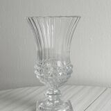 Antique thick glass vase on a pedestal.