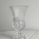 Antique thick glass vase on a pedestal.