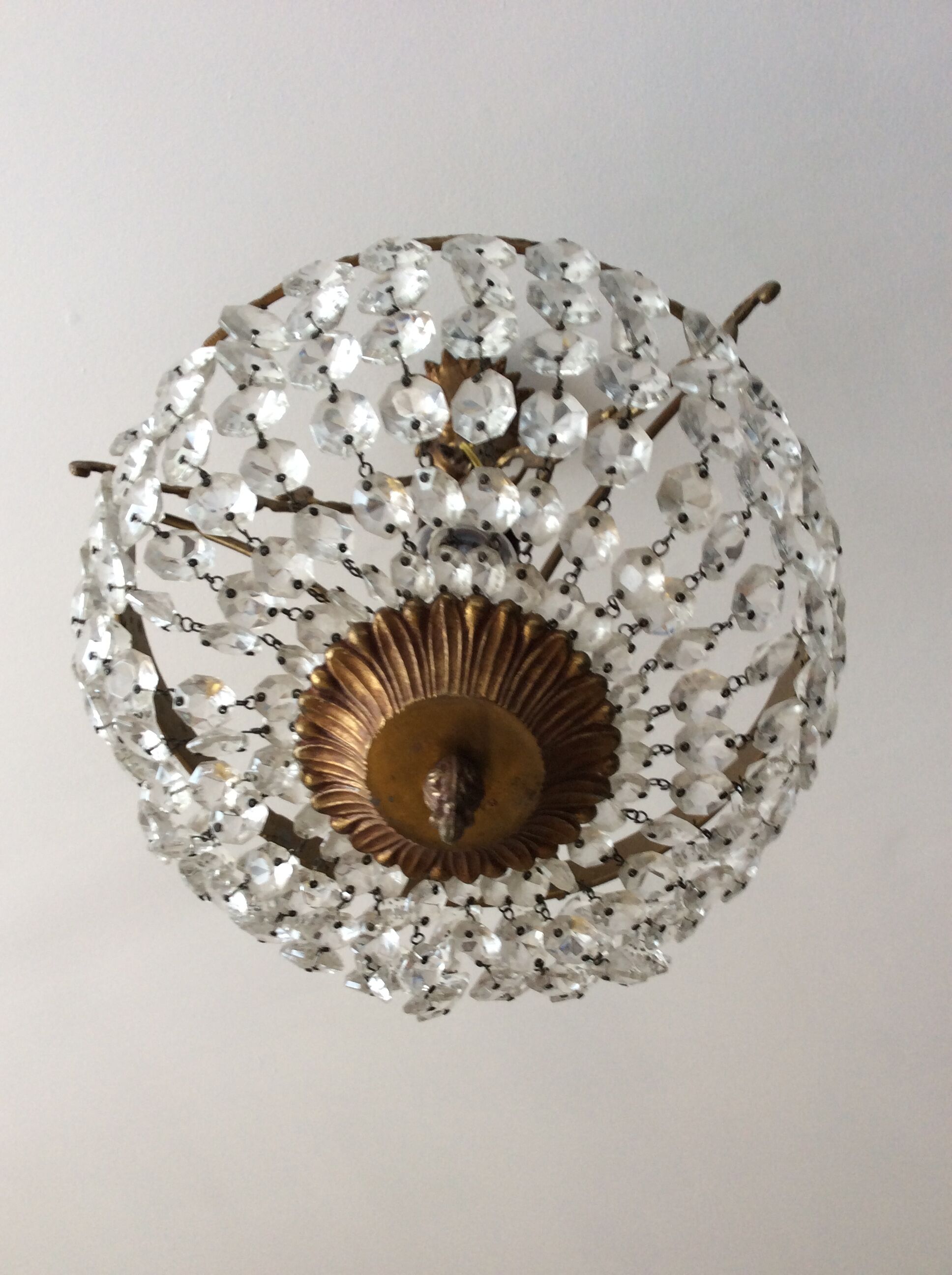 Old chandelier with bronze stamps