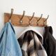 Wall-mounted coat rack with 5 vintage-style hooks in patinated wood and metal.