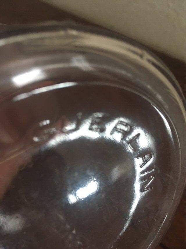 Guerlain bottle with bees.