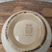 Old opaque porcelain bowl from Gien with a floral decoration.