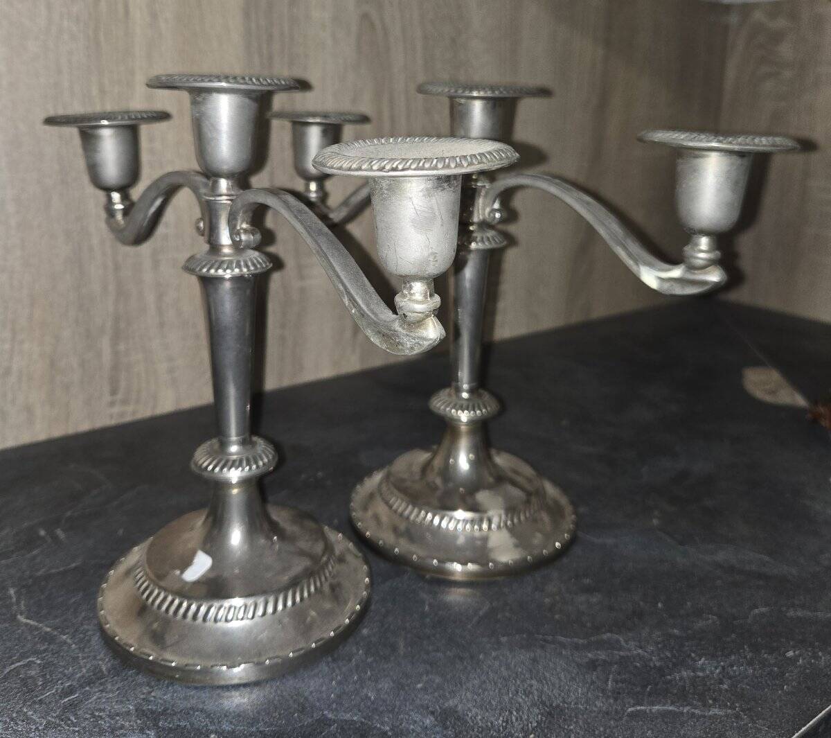 Pair of three-light candlesticks in silver-plated metal