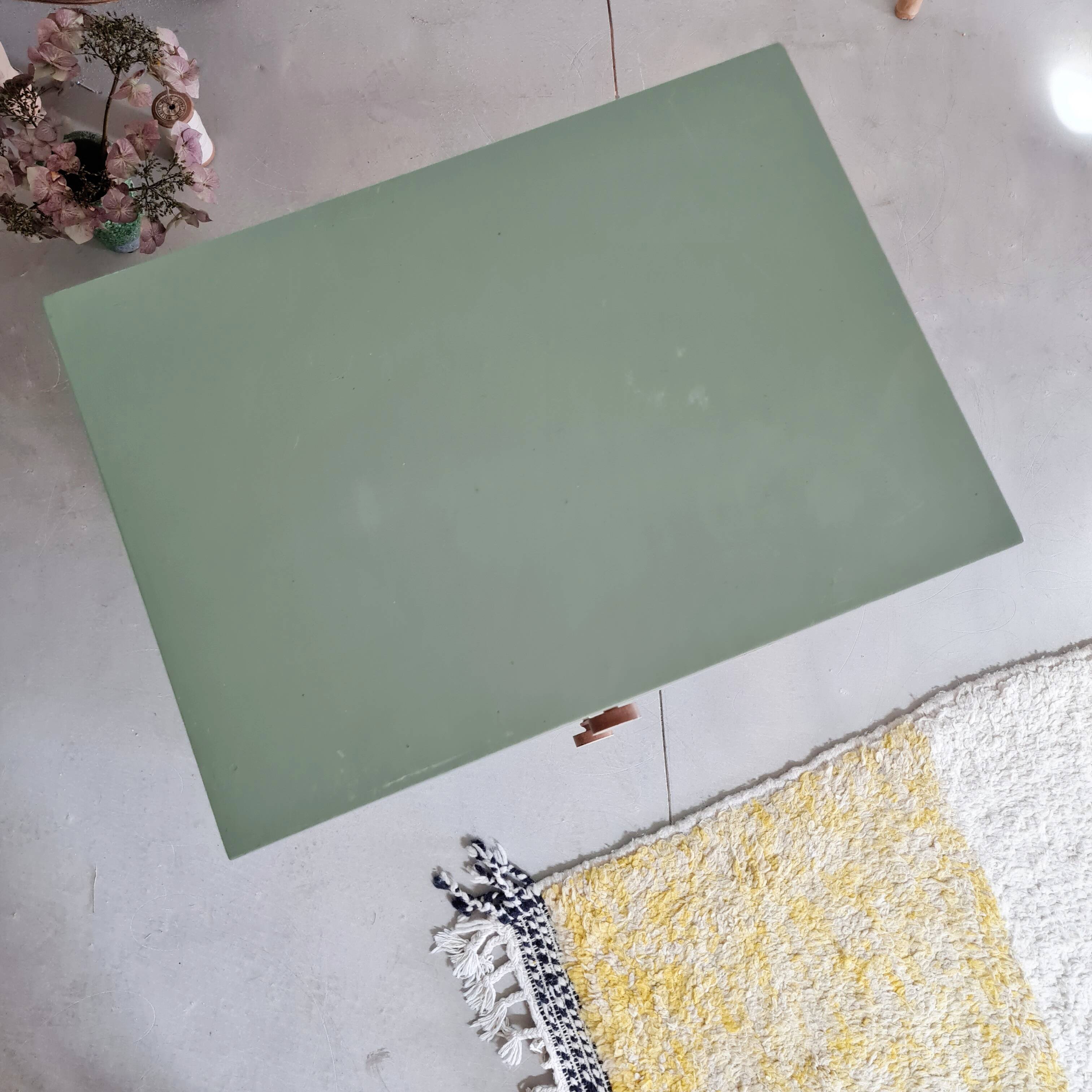 Old chest of drawers with two green drawers