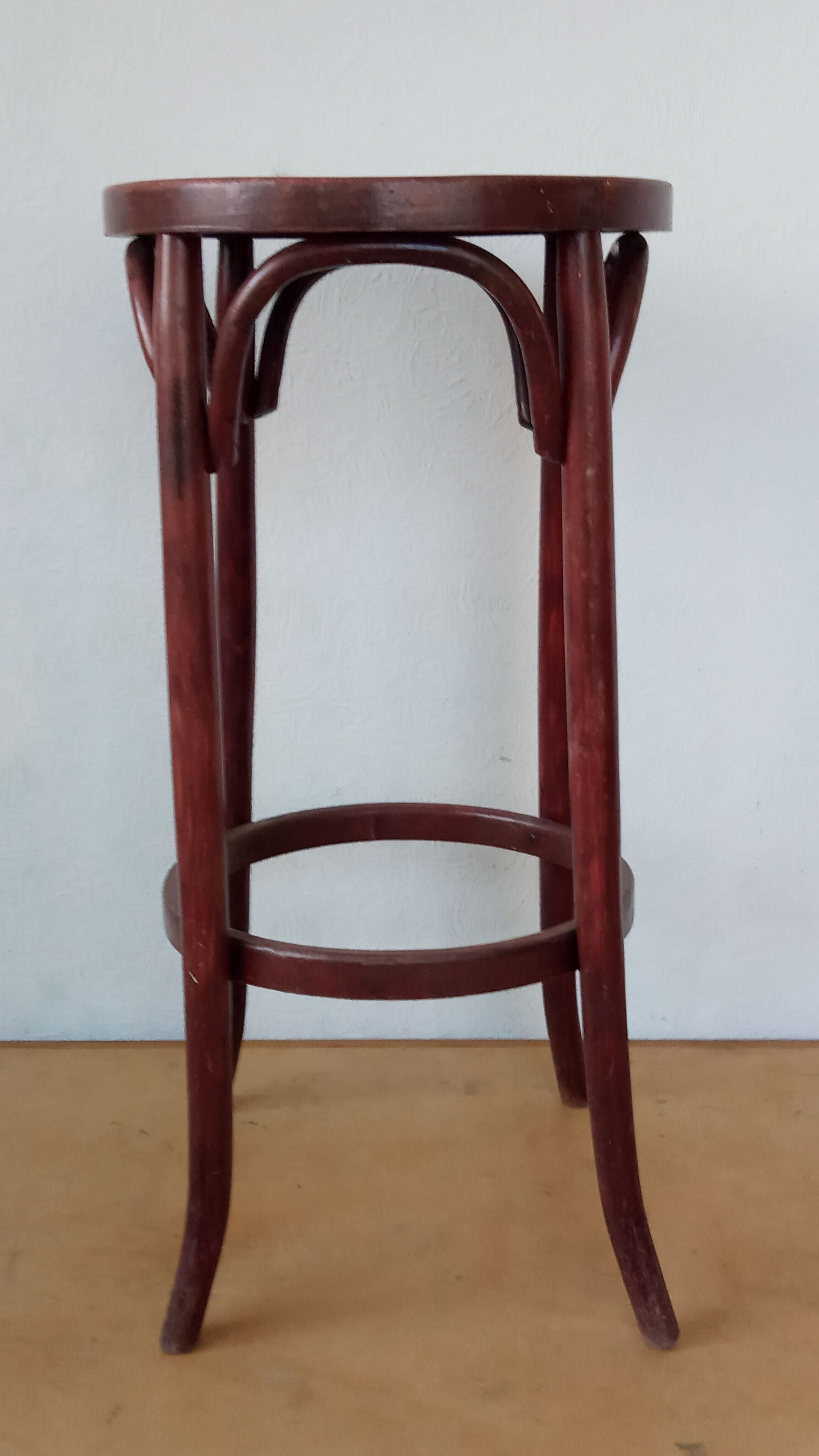 Curved wooden bar stool