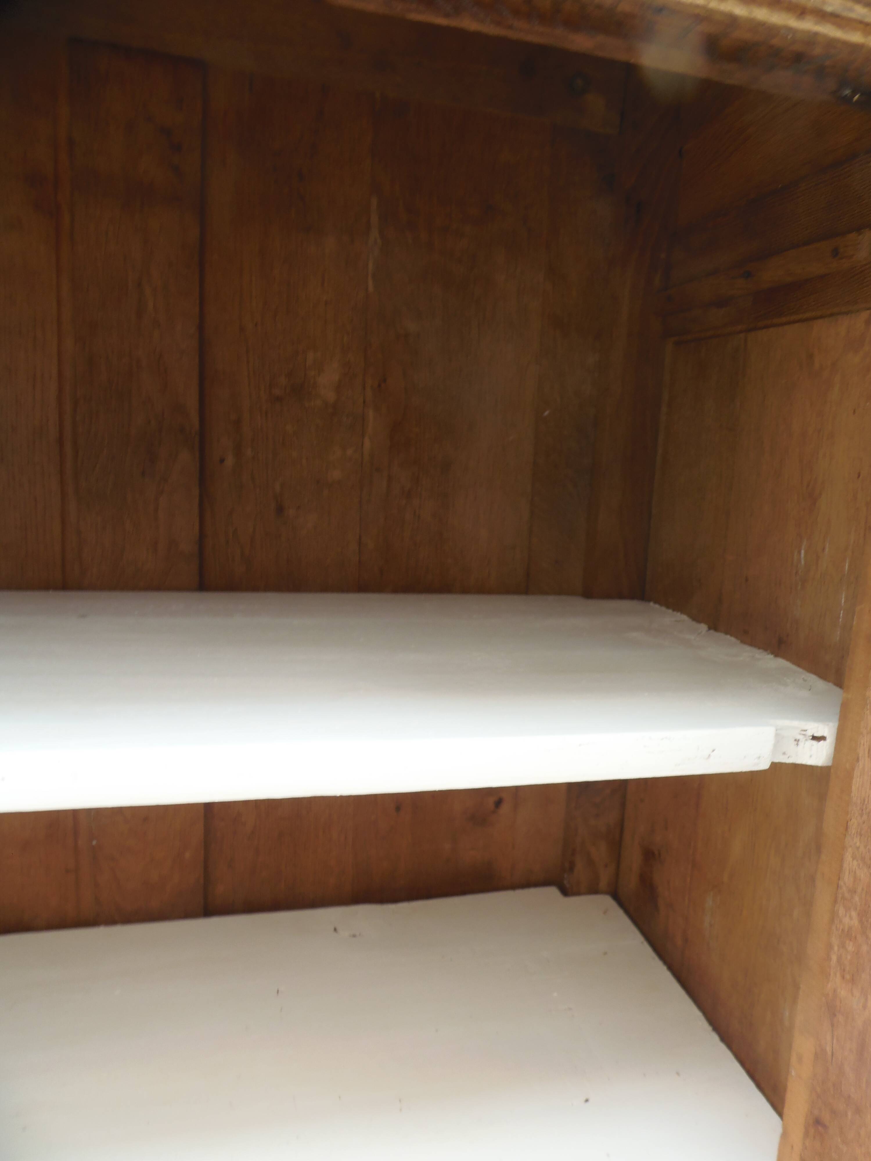 Antique wooden sideboard, fabric doors and pearl grey shelves.