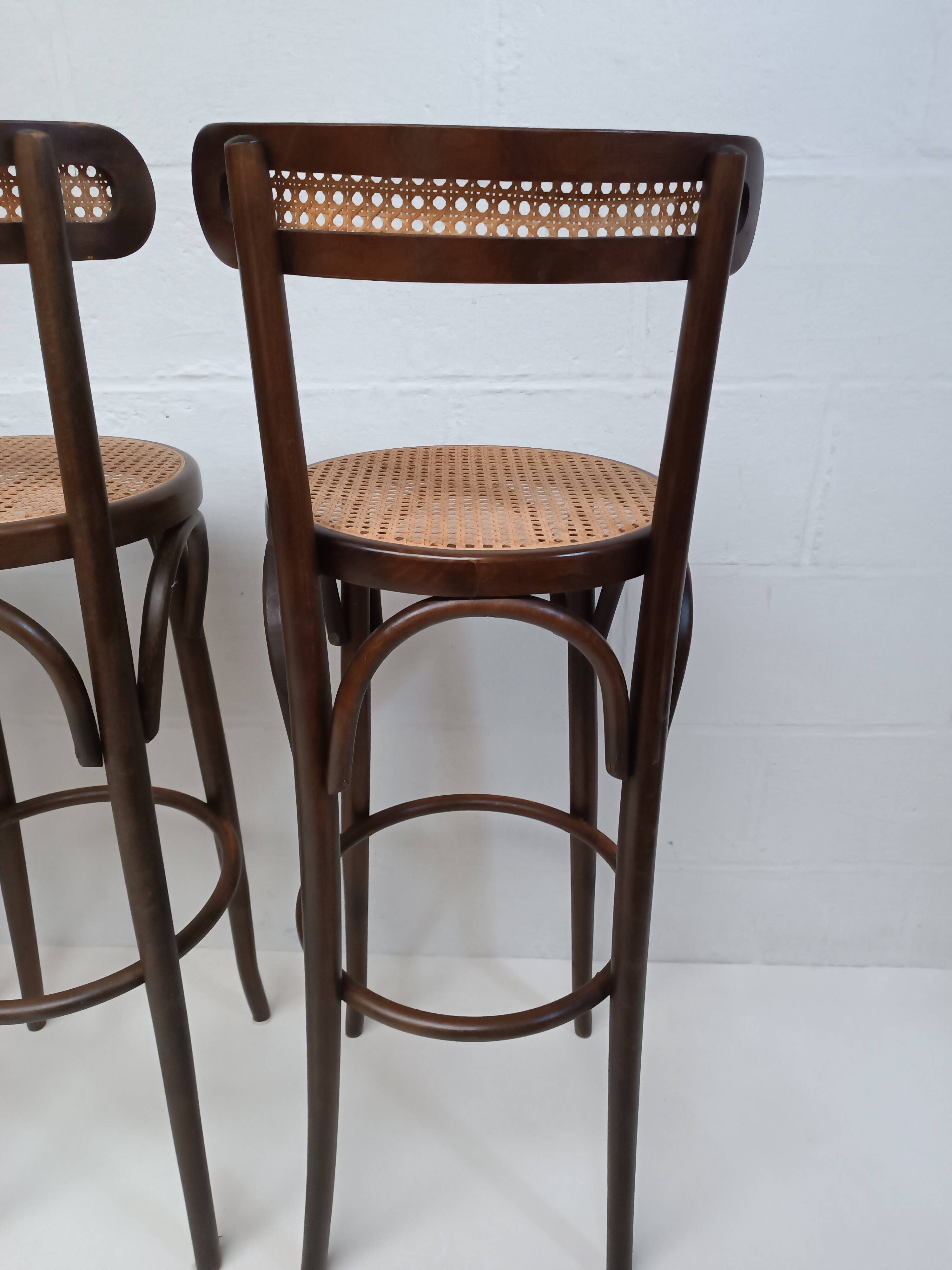 4 curved wood and cane bar stools