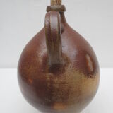 ancient water jug in vitrified sandstone, bulging avc handle