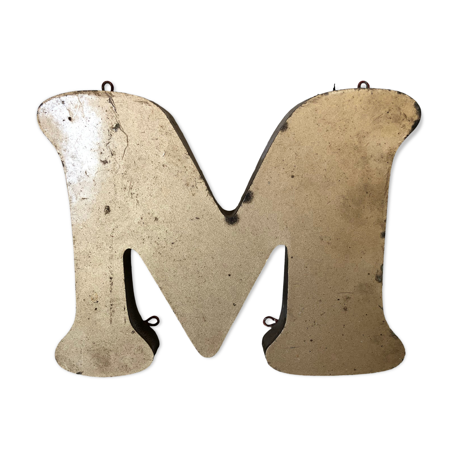 Golden sign letter "M"