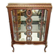 A Louis XV style display cabinet with three beechwood shelves and a white marble top.