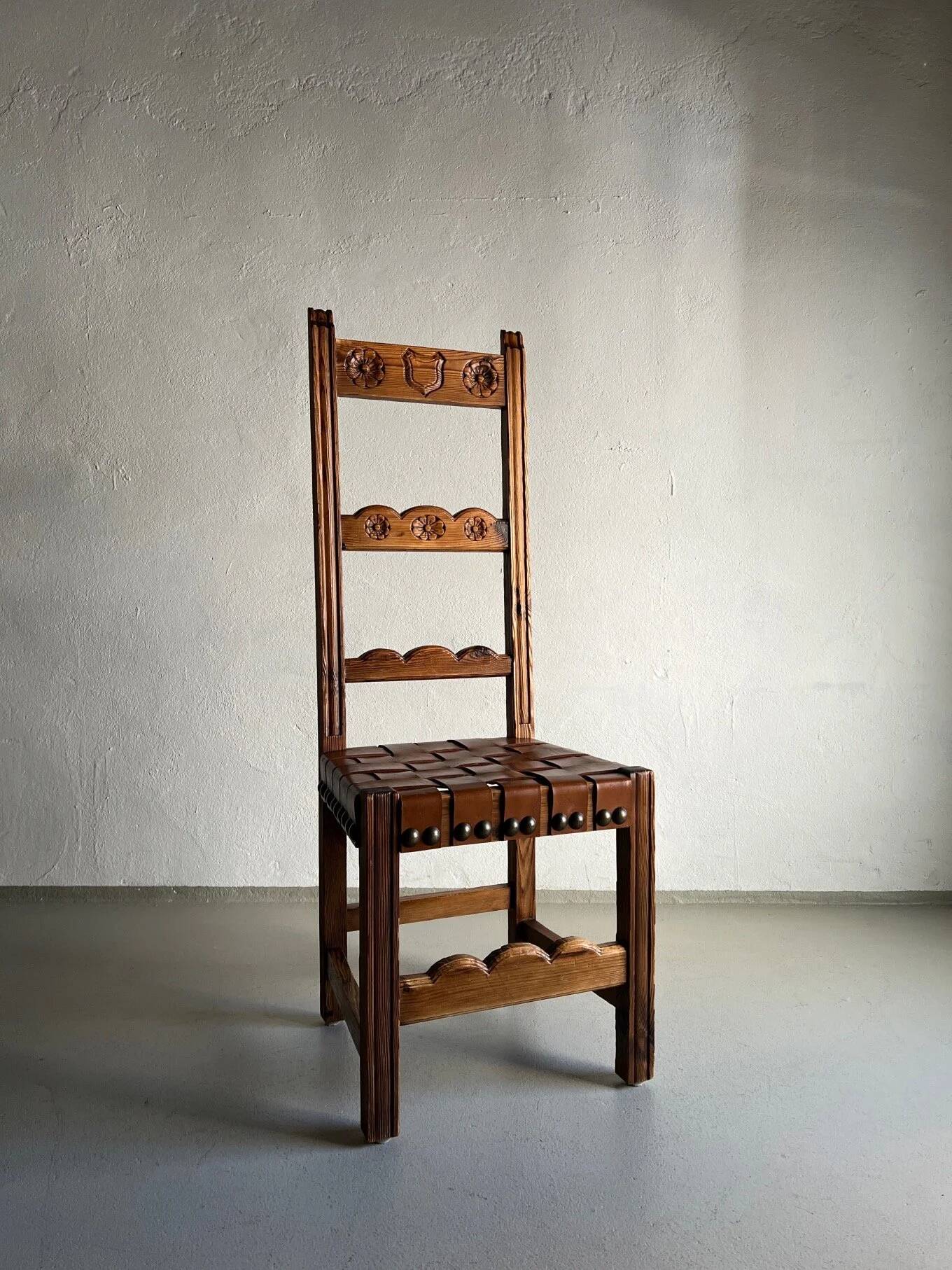 2 brutalist carved wood dining chairs with leather seat | The Netherlands | 1970s