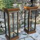 Pair of display cases in magnifying glass and black & gold lacquer, 20th century period