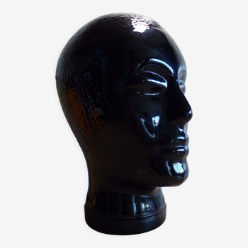 Antique hat head in black glass