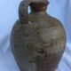Ancient jug in glazed sandstone