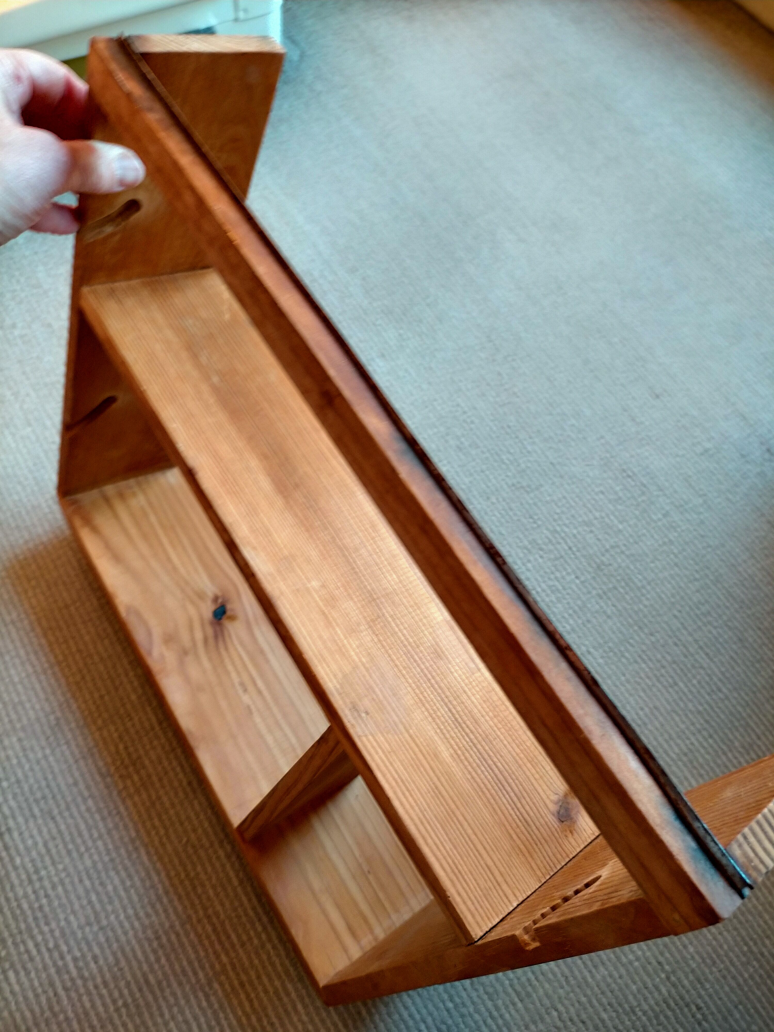 Wooden shelf with unroller wipes everything