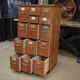 Office furniture has oak drawers 1950 brass handles and label holders