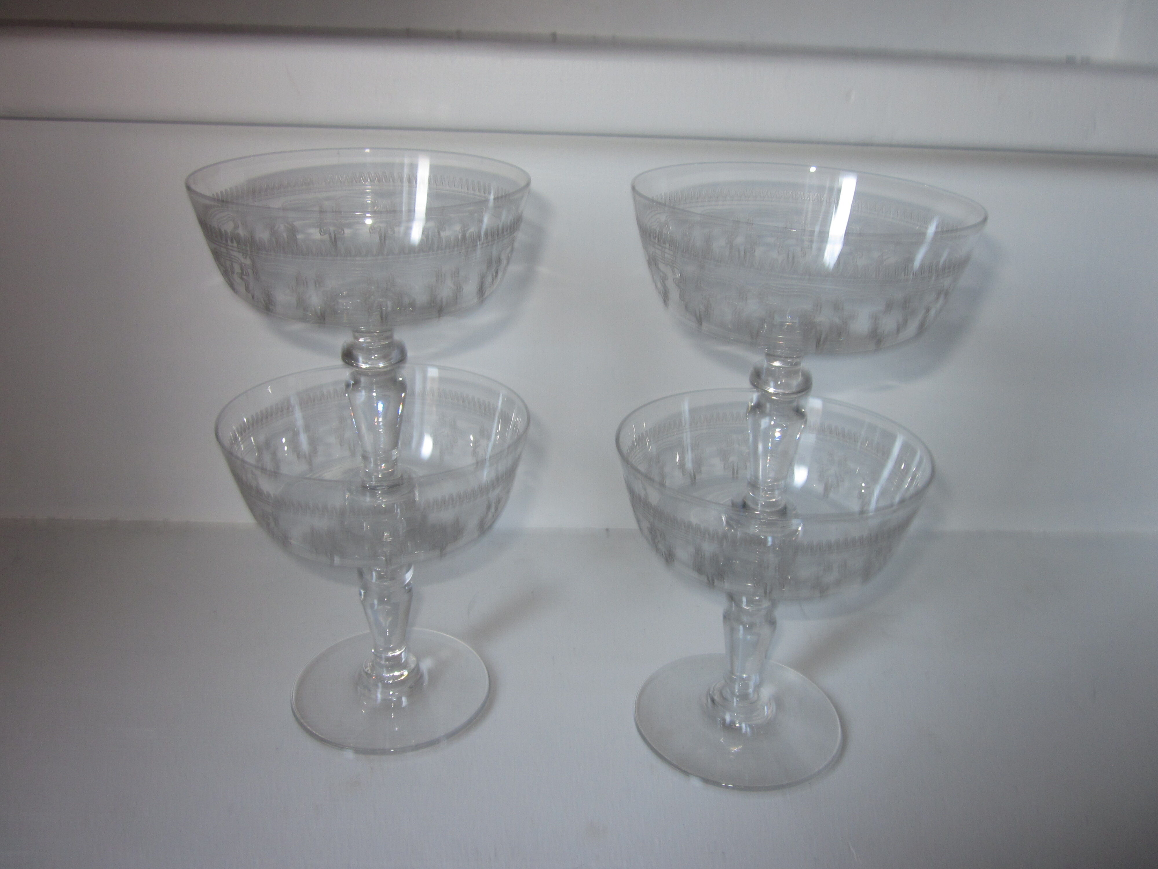 4 old champagne glasses