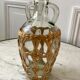 Bottle with handle and covered with wicker / rattan 70s