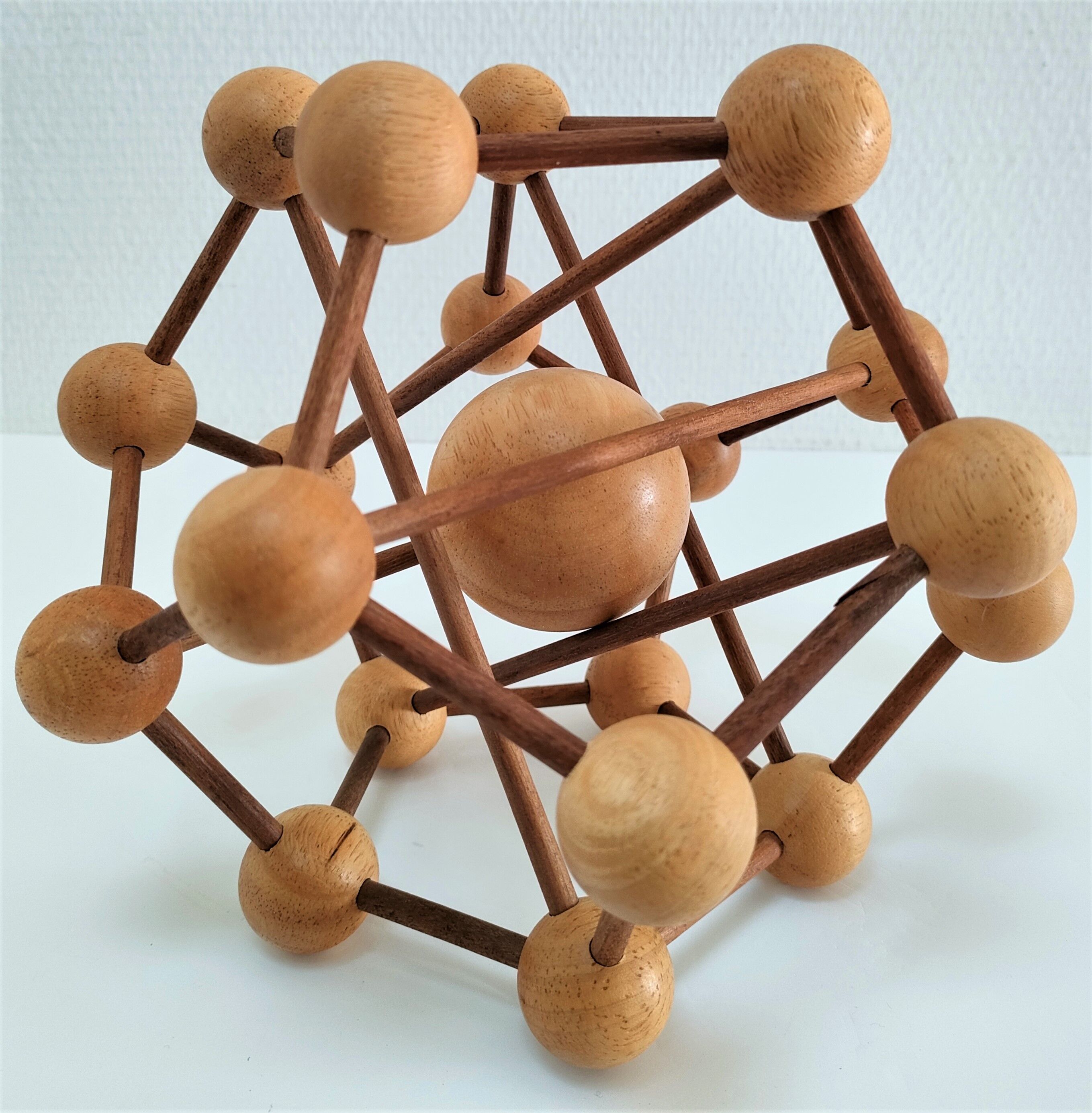 Sculptural modeling of a solid wood atom contemporary design