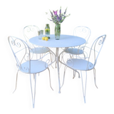 Renovated round table and garden armchairs