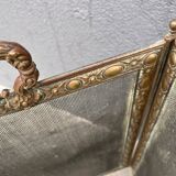 Antique fireplace screen in copper and brass from the 19th century.