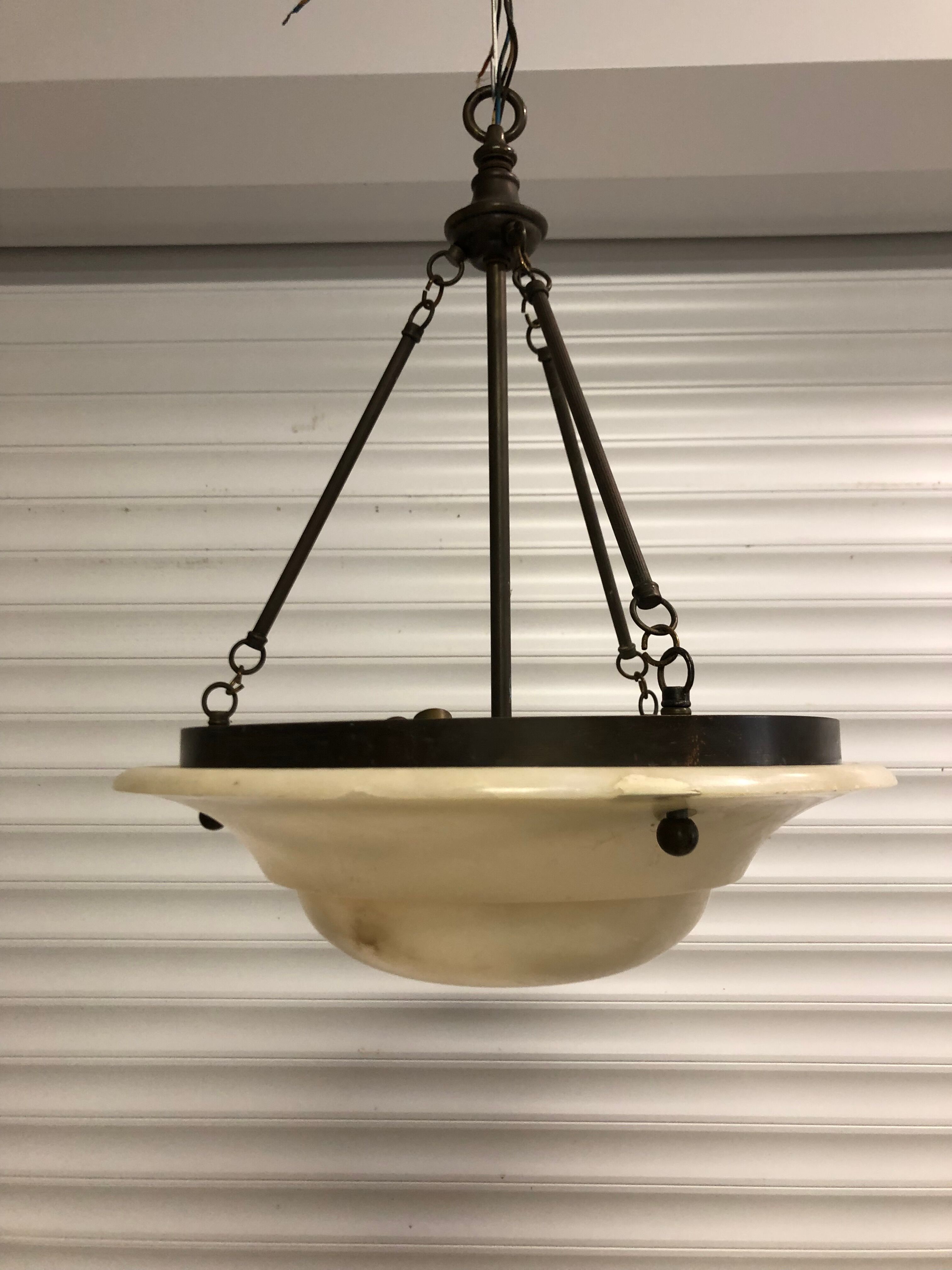 Chandelier in white alabaster and antique brass.