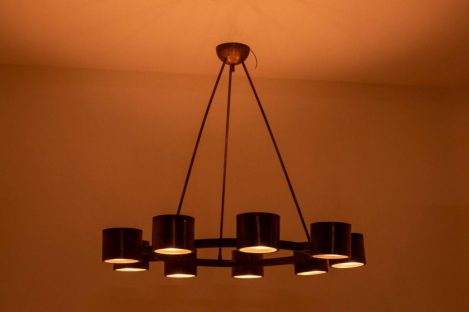 Matte gold brass circular chandelier. Contemporary Italian work.