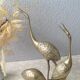 Golden brass herons