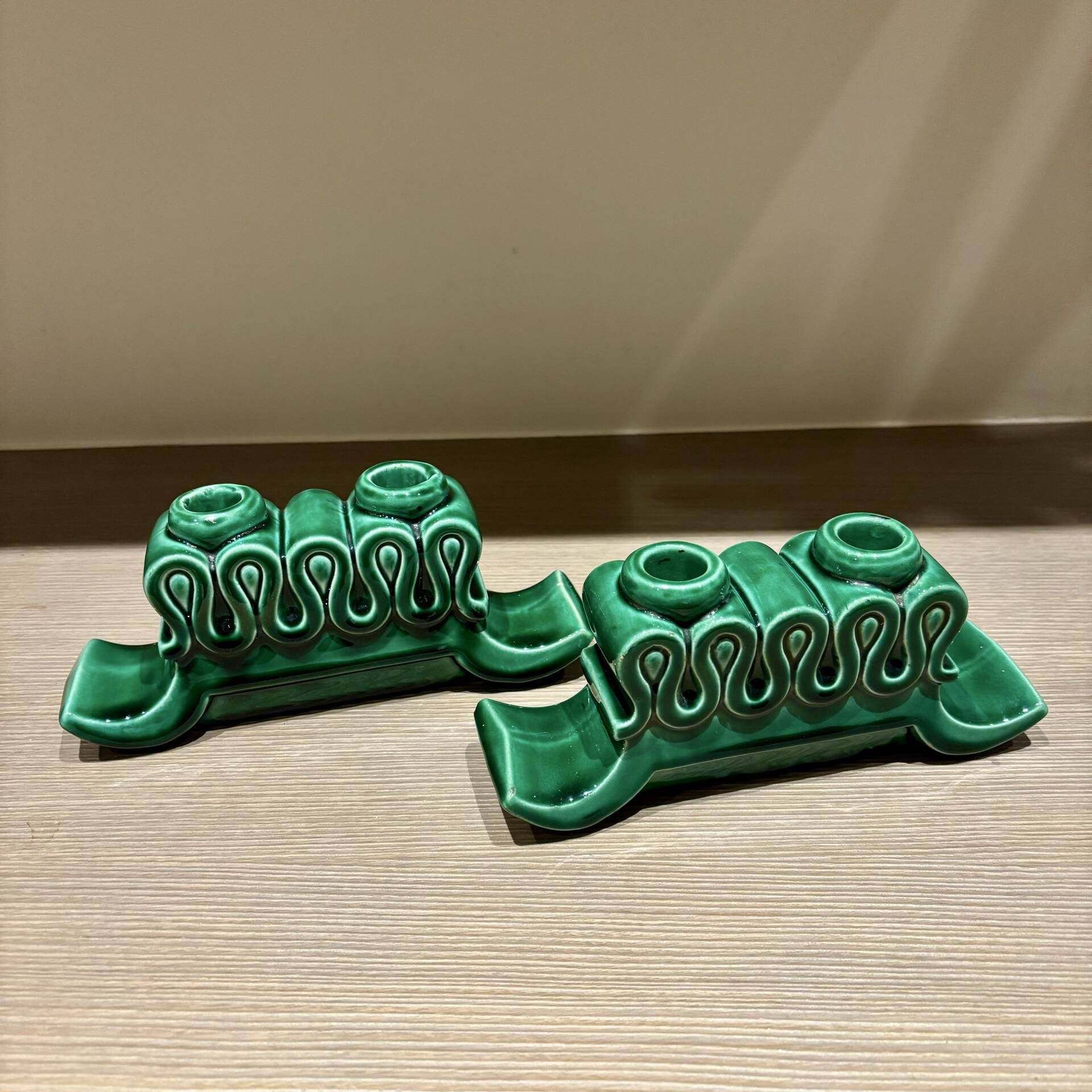 Pair of Art Deco green ceramic candlesticks