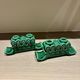 Pair of Art Deco green ceramic candlesticks