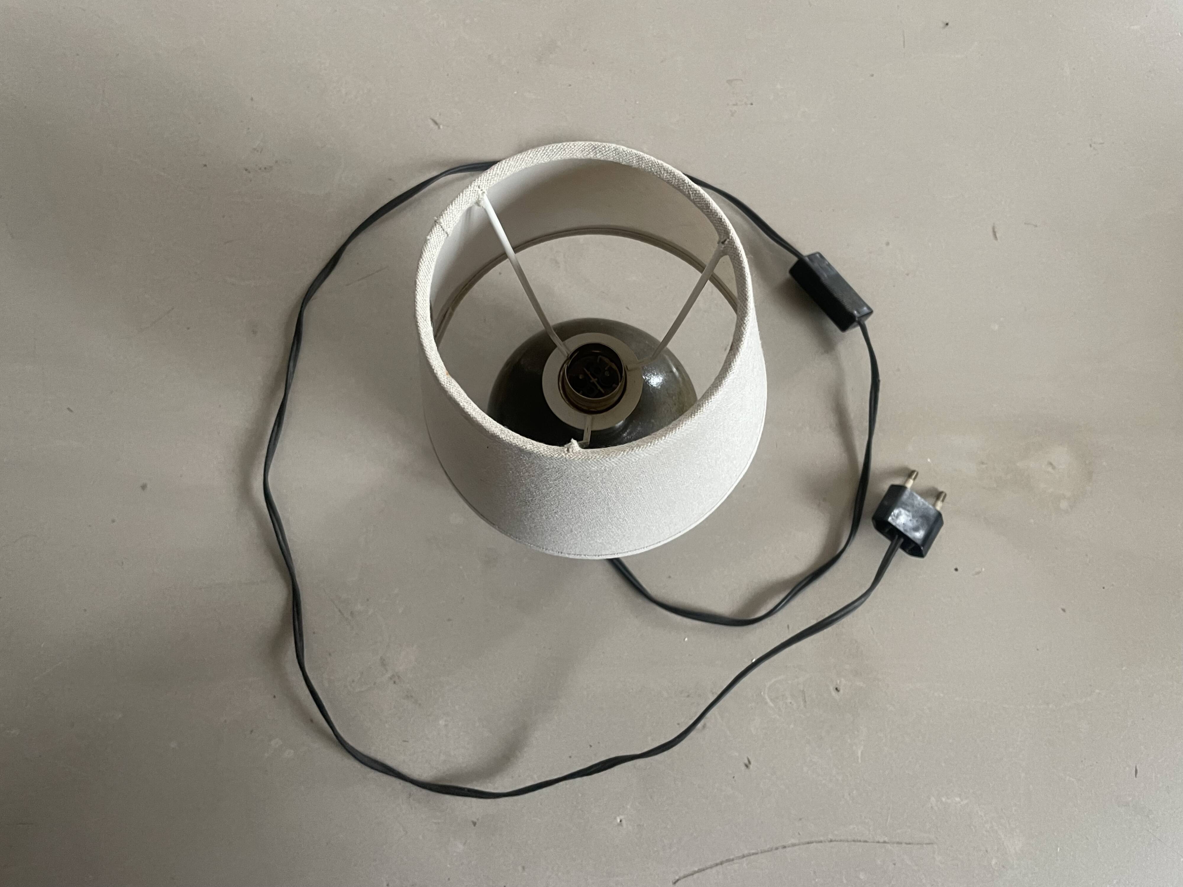 Small old enamelled sandstone lamp