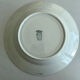 A deep plate in blue and green ironstone, antique French earthenware.