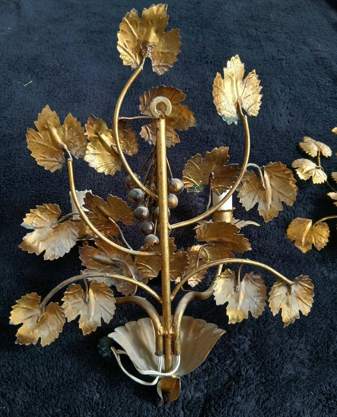 Stunning vintage wall lights in gilded iron with vine and grape decor from Italy.